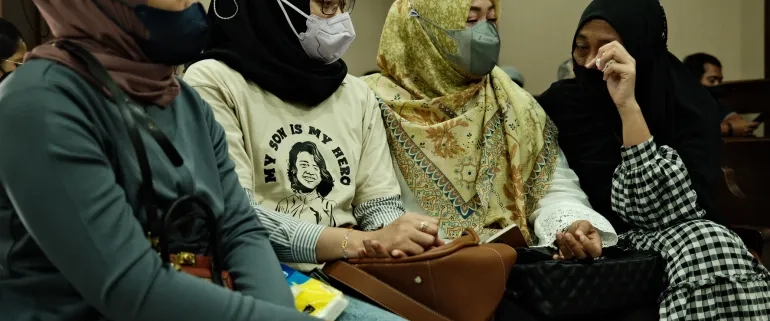 Siti Suhardiyati, Safitri Pusparani, Solihah and Desi Permata Sari say they have found comfort in each other, as they seek justice for their children [Jessica Washington/Al Jazeera]